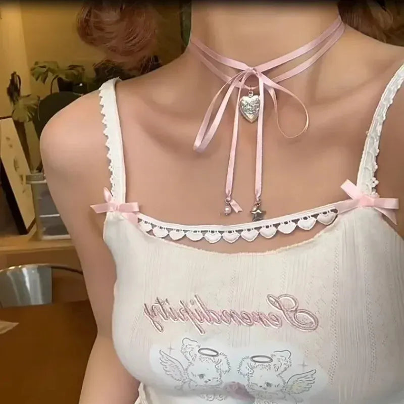 Women's silver-tone alloy necklace with a ribbon-shaped love pendant on a thin chain.