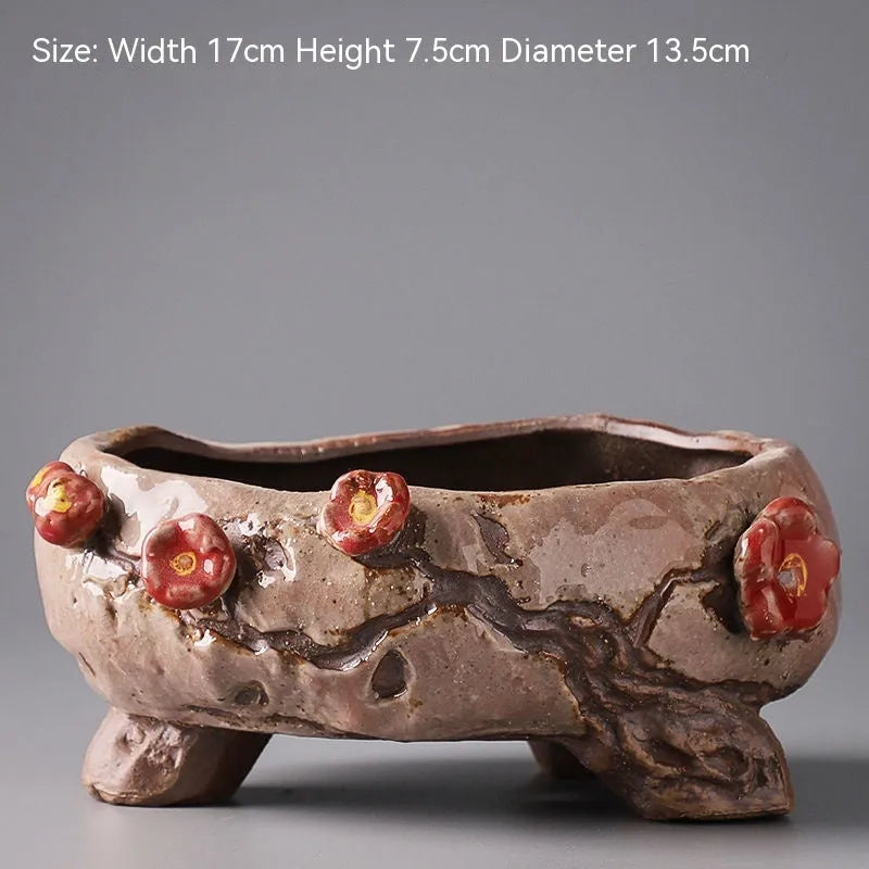Large calibre ceramic flower pot with hand-painted cute pastoral design on a white background.