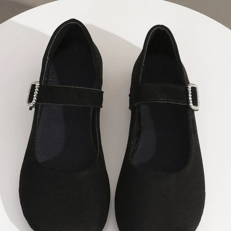 Black canvas fisherman shoes with flat rubber soles shown in adult sizes