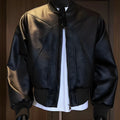 Men's black PU leather business jacket with extended length and slim-fit tailoring on hanger