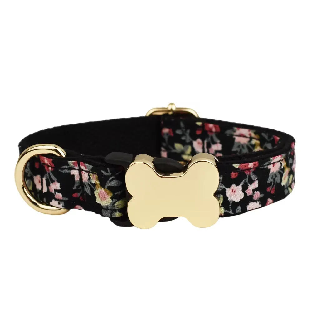 Flat printed grid nylon dog collar with a white bone-shaped plastic buckle on a green background.