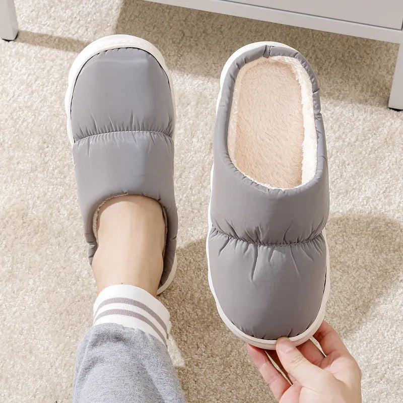 Blue down cotton slippers with thick rubber sole and plush lining, shown from side.