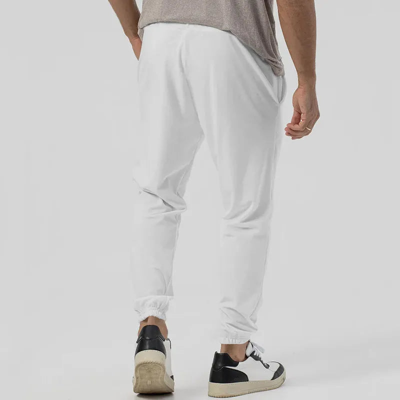 Men's grey cotton blend casual sweatpants with straight legs and a mid-rise waist on a hanger.