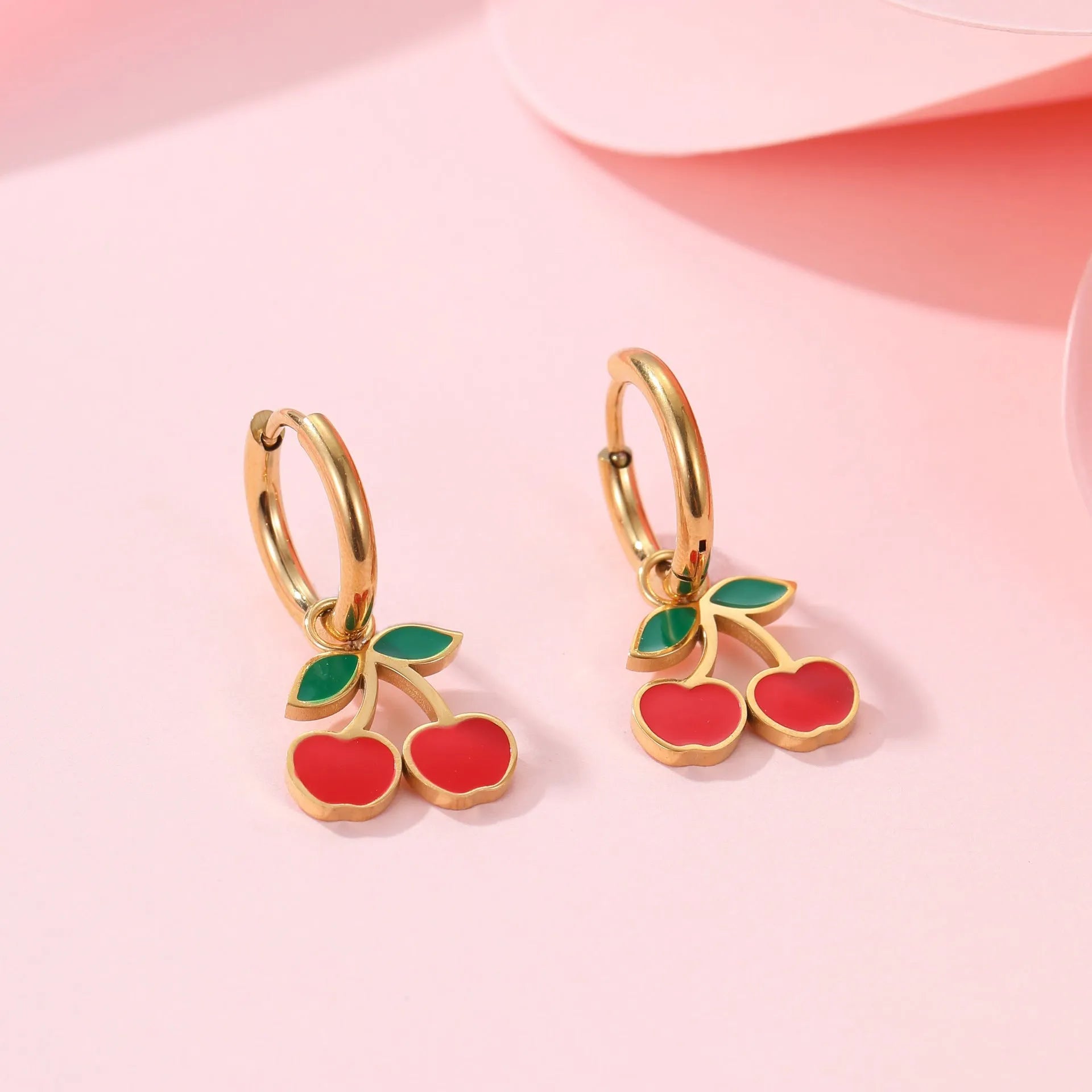 Stainless steel 18K gold plated cherry jewellery set showing necklace, bracelet, earrings, and ring.