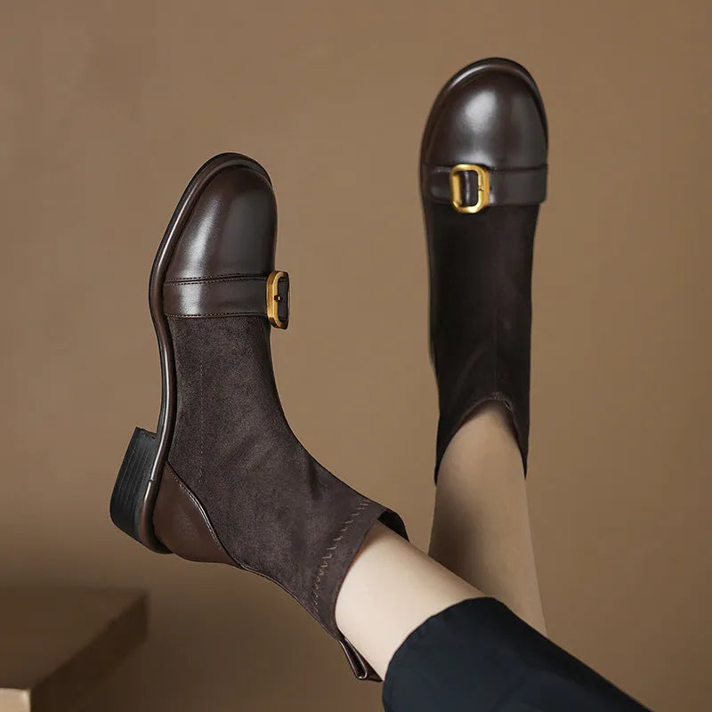 Women's black low heel ankle boots with lace-up front and decorative belt buckle stitching