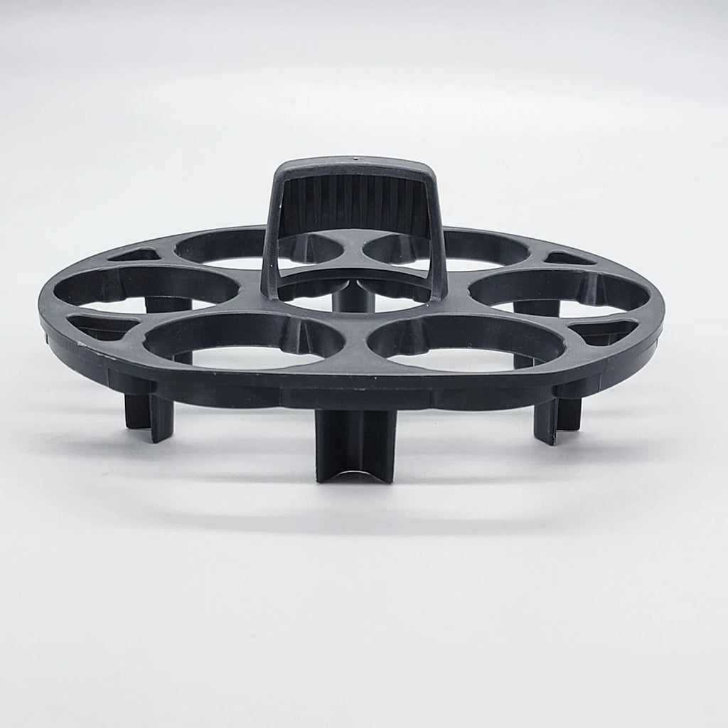 Black modern plastic egg holder rack on a kitchen surface.