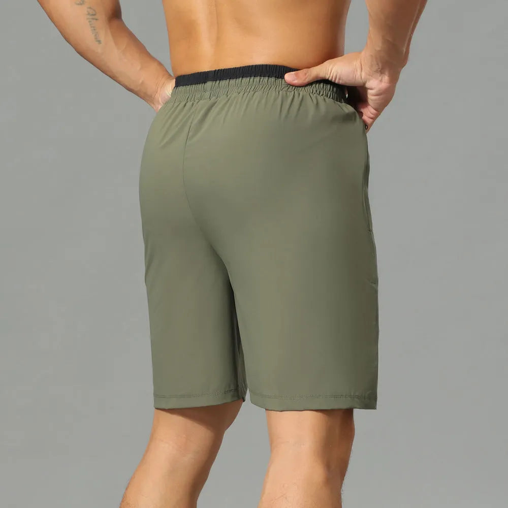 Men's grey loose ice silk quick-dry cropped pants showing mid-calf length and sportswear styling