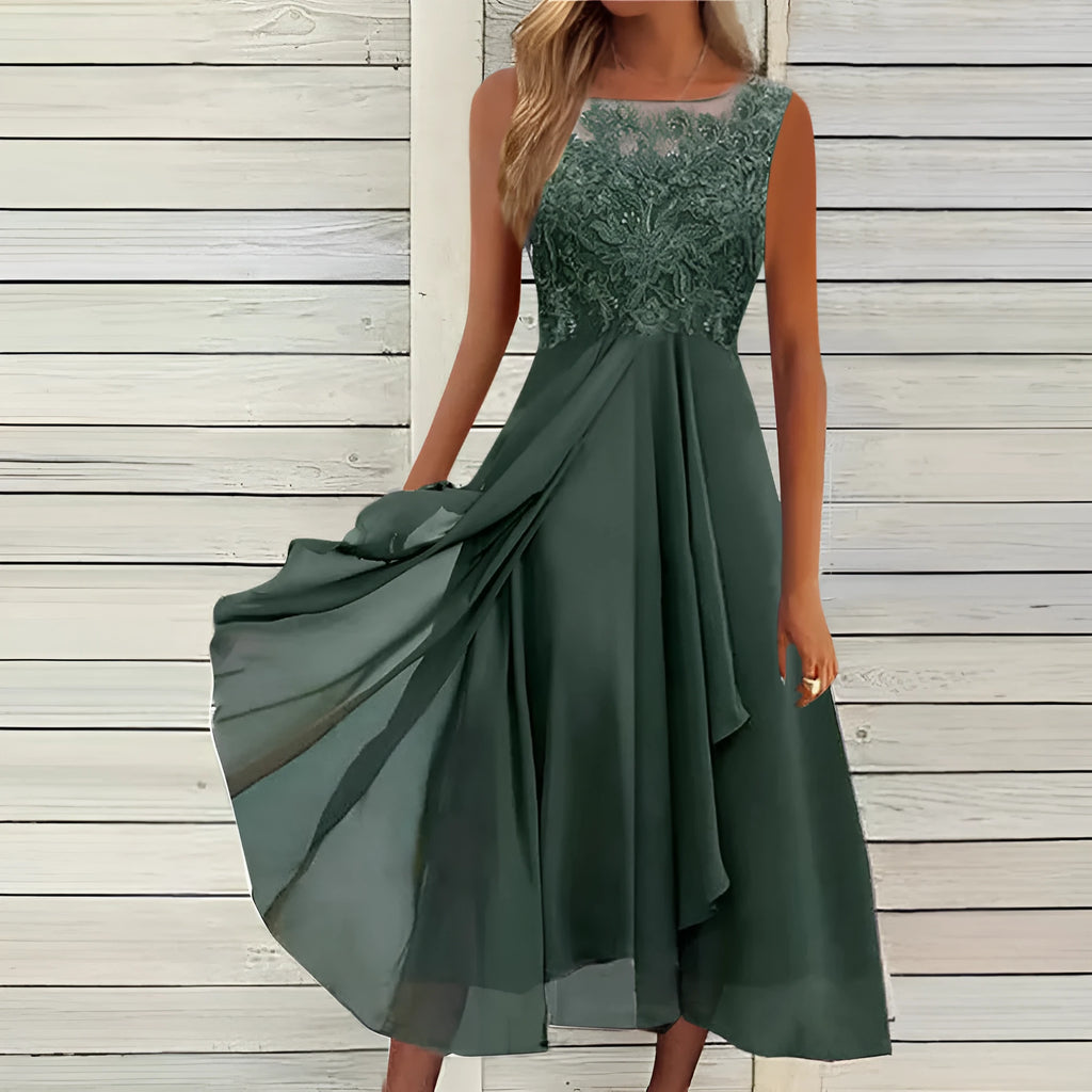 Women's sleeveless green chiffon dress with lace hollow-out detailing on a mannequin.
