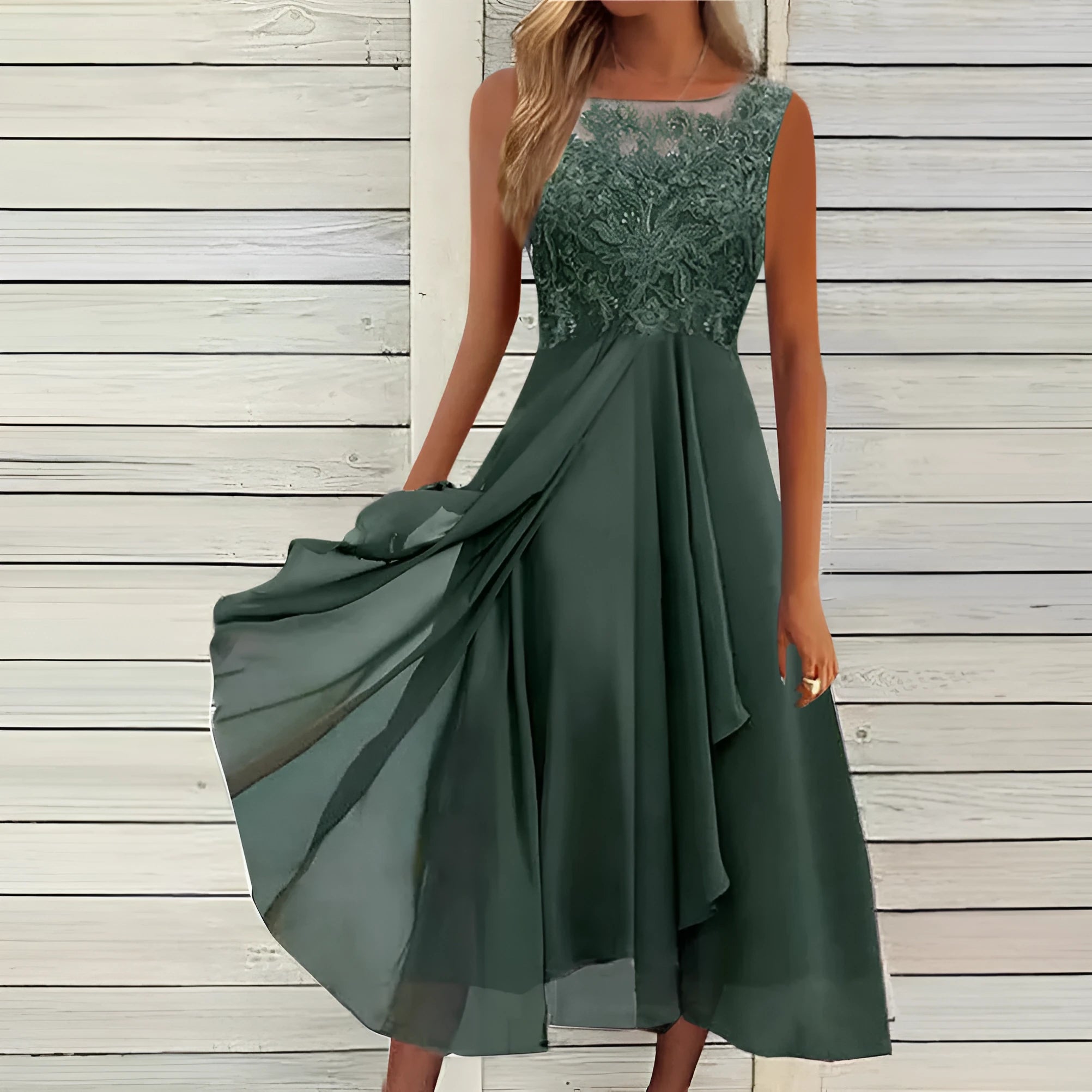 Women's sleeveless green chiffon dress with lace hollow-out detailing on a mannequin.