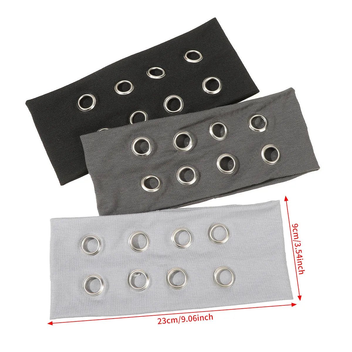 A black polyester exercise hair band with a hollow metal decorative centrepiece.