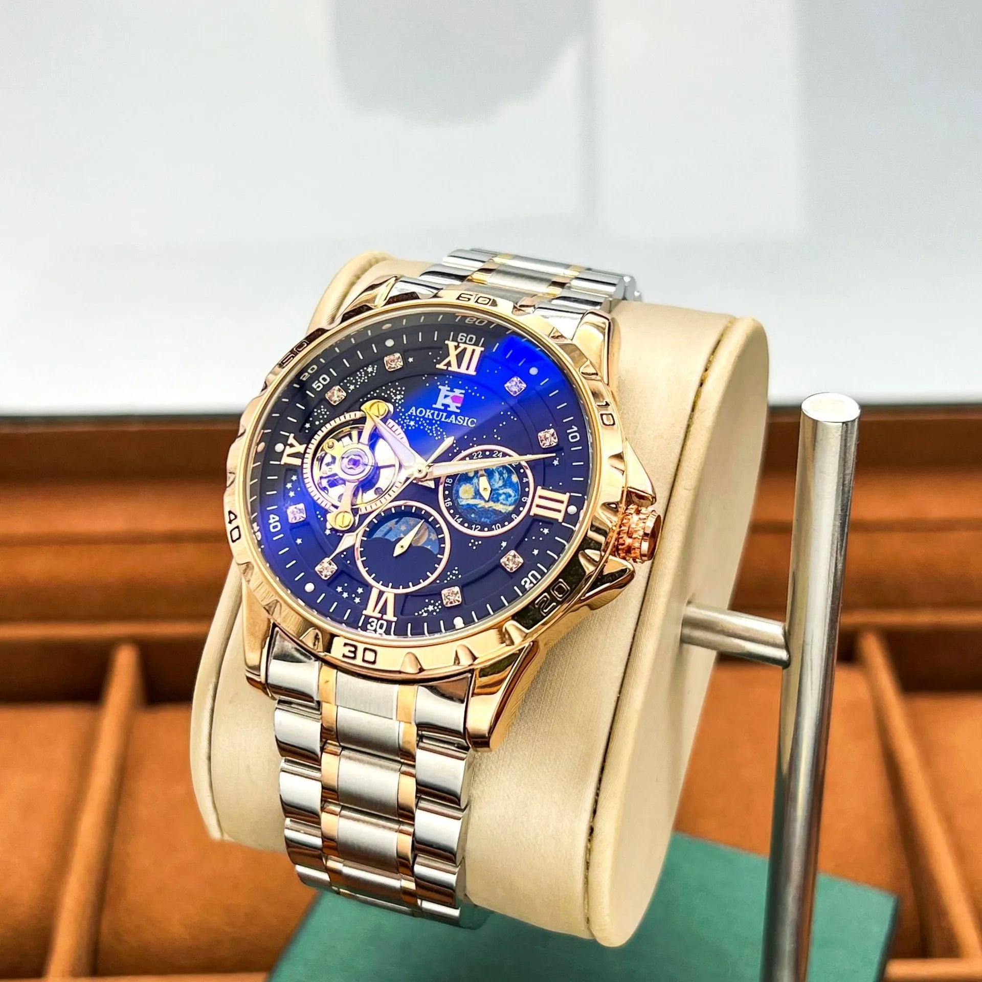 Automatic mechanical men's watch with rose gold case, black dial, and large display.