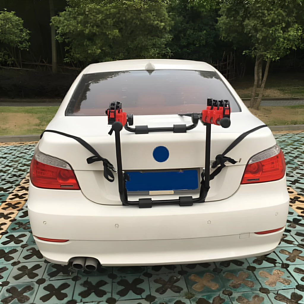 Black and red trunk mounted car bike holder rack with iron frame and sponge padding.