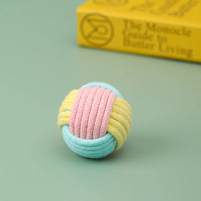 Handmade small blue powder, green blue, and pink green plush cotton ball cat toy for teeth grinding.
