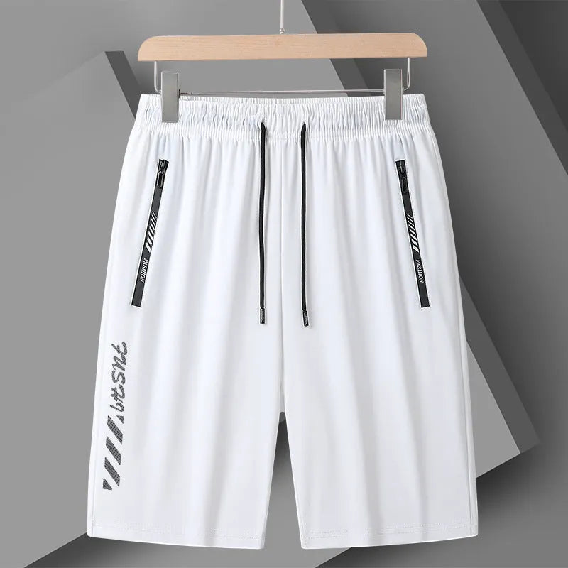 Man's black loose-fit quick-dry nylon sports shorts with elastic waistband on a plain background.