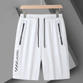 Man's black loose-fit quick-dry nylon sports shorts with elastic waistband on a plain background.