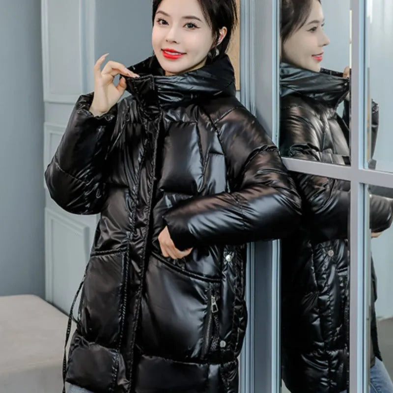 Women's loose thick hooded winter jacket in green, shown on a hanger.