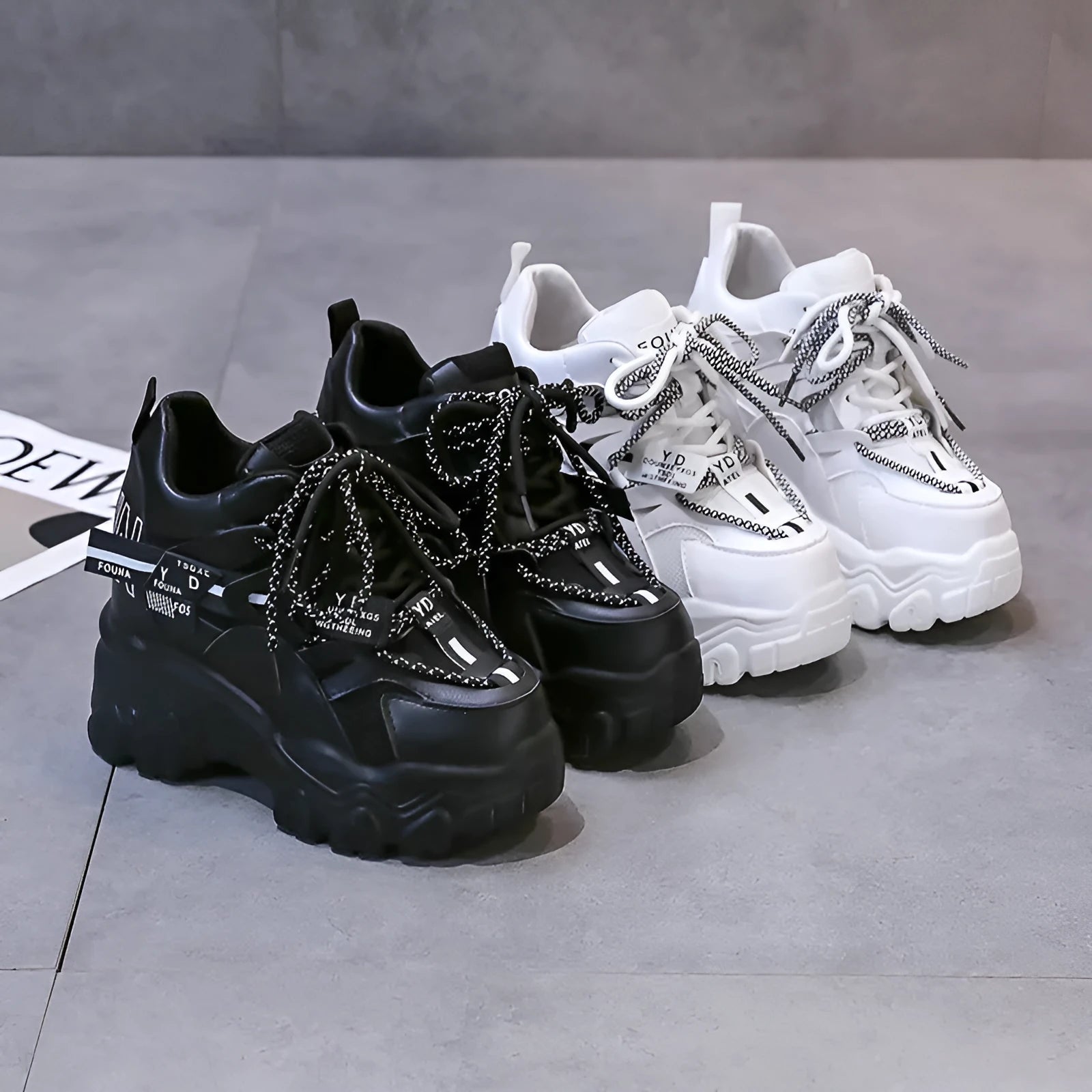 Women's white mesh platform sports shoes with a cross strap and rubber sole.
