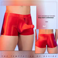 Men's seamless nylon boxer shorts in red with an elephant nose pattern, showing mid-waist fit.