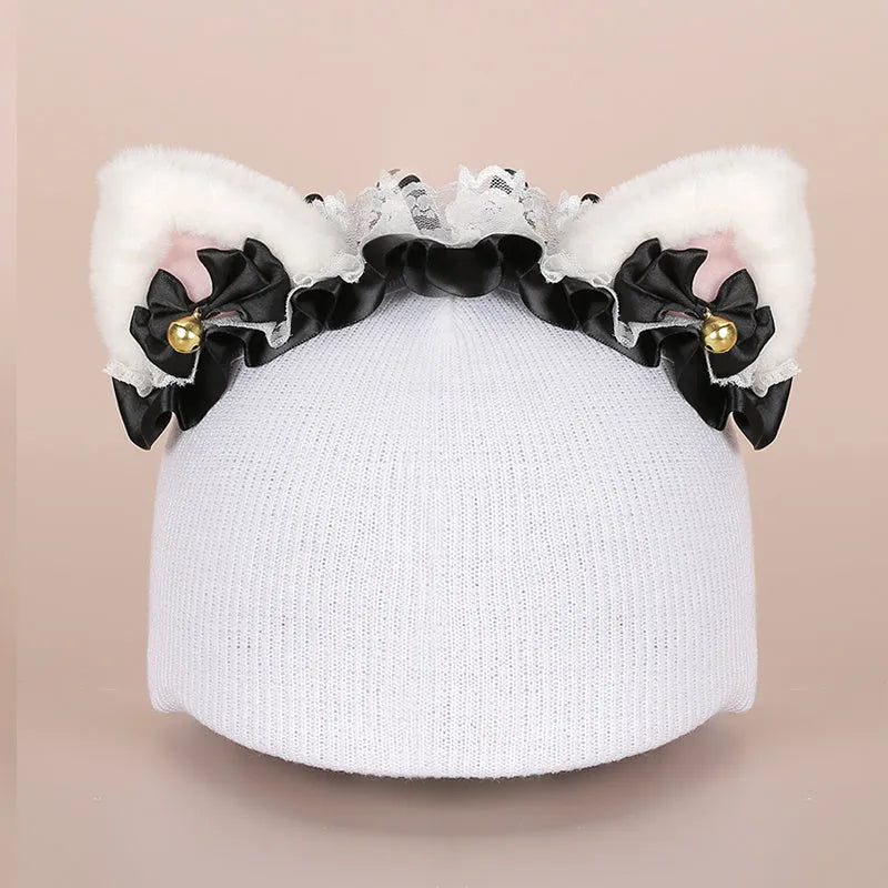 Plush cartoon-themed cover set on a medium motorcycle helmet with soft ear decorations.