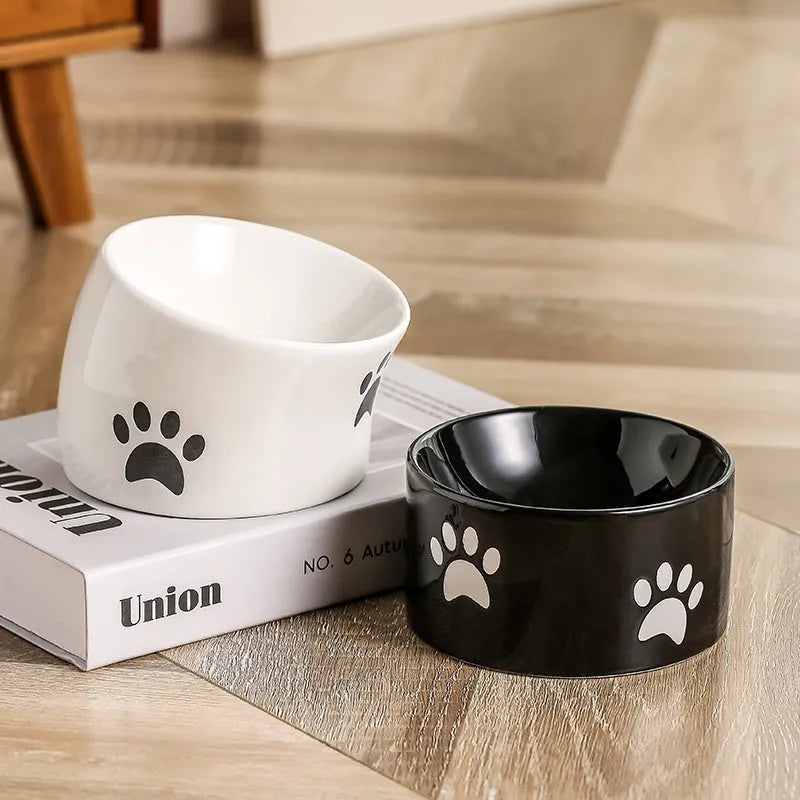 Ceramic cat food bowl with high foot design and cat's paw pattern in choice of colours