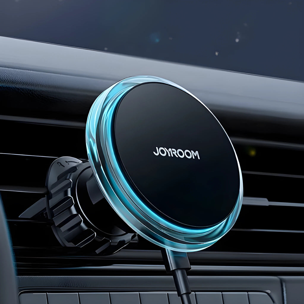 Black magnetic wireless charging phone holder mounted on a car air vent.