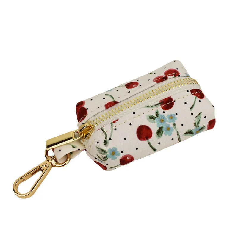 Red cherry printed dog collar with light gold buckle and matching leash set with bow accessory