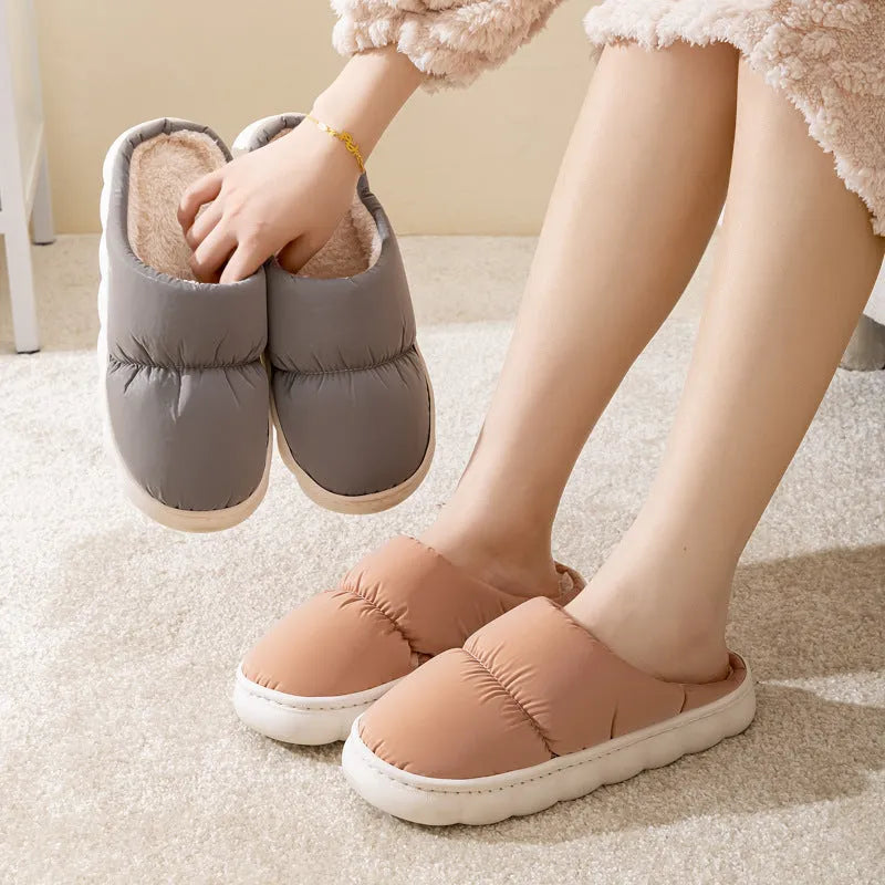 Blue down cotton slippers with thick rubber sole and plush lining, shown from side.