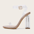Apricot-coloured women's high heel sandals with a clear glass heel and a buckle strap fastener.