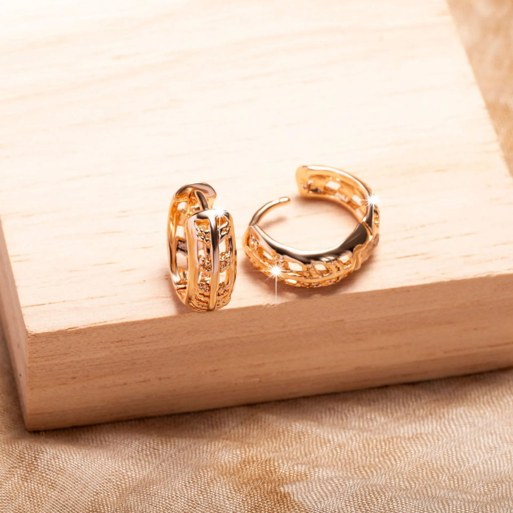 Rose gold plated copper stud earrings with hollowed leaf and heart design.