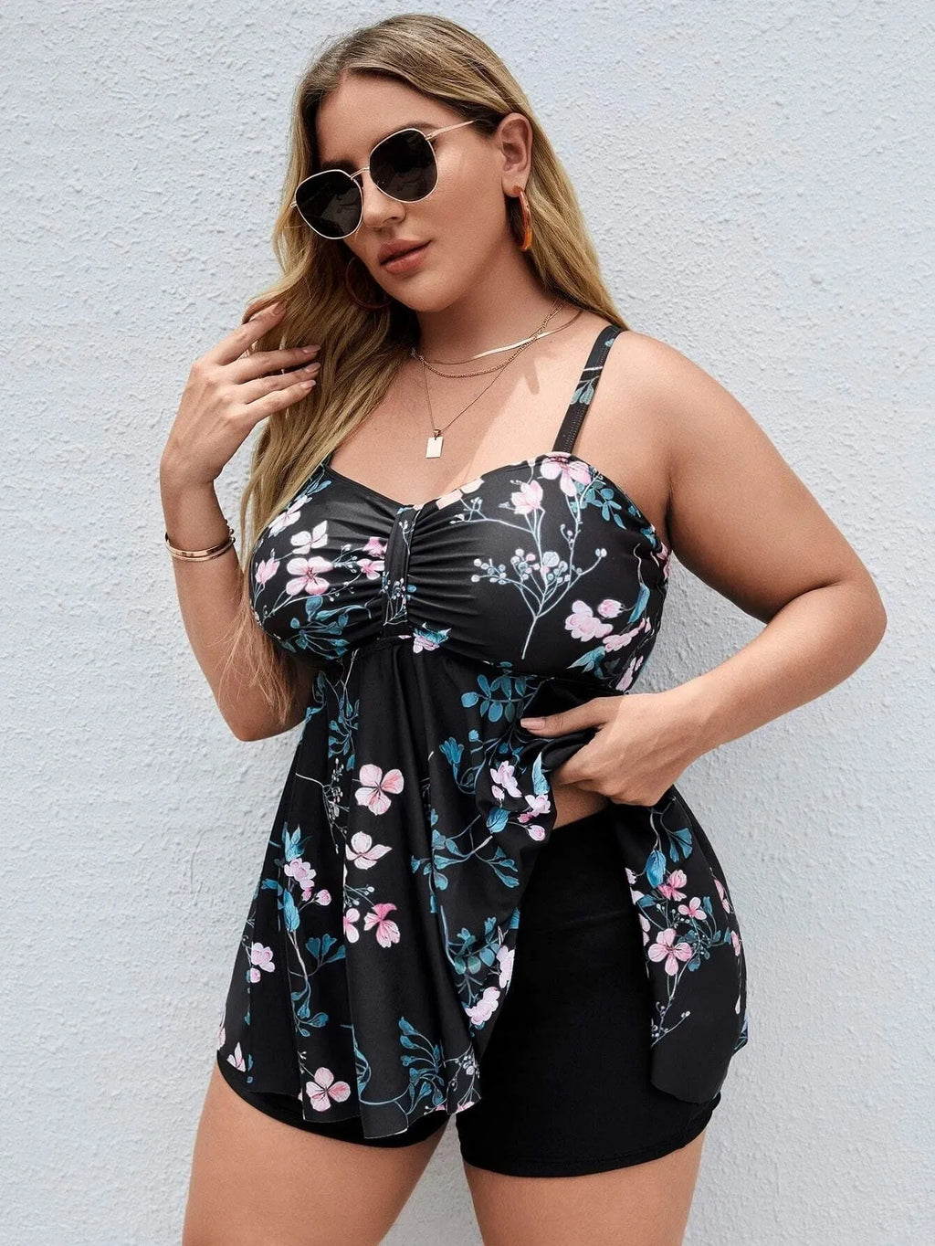 Women's floral print one-piece swimsuit in split colours, available in plus sizes.