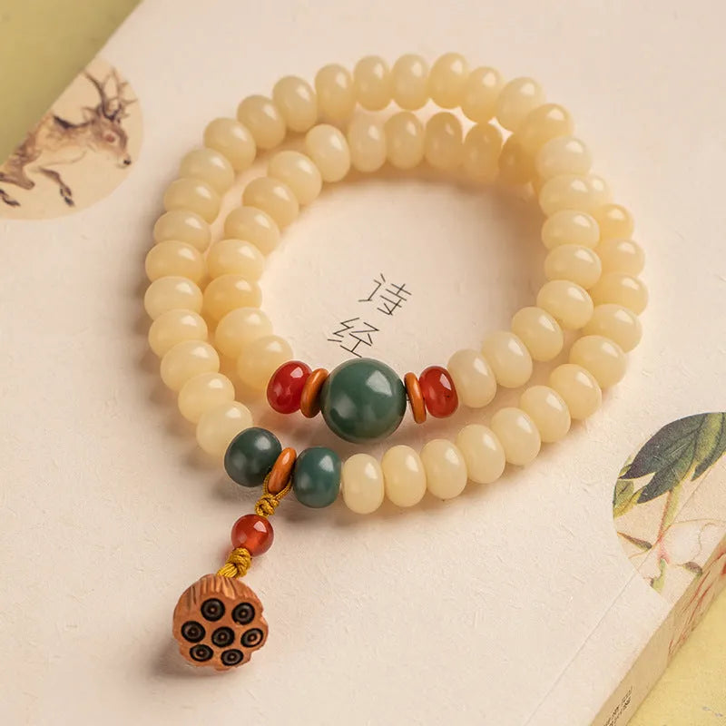 Wooden bracelet with flat round cream topaz beads for a 15-20cm wrist.