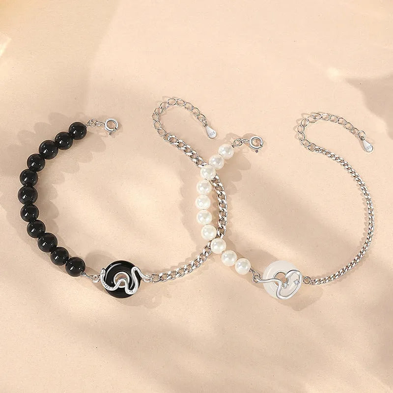 925 sterling silver bracelet with obsidian pearl, snake design, and safe buckle in New Chinese style.