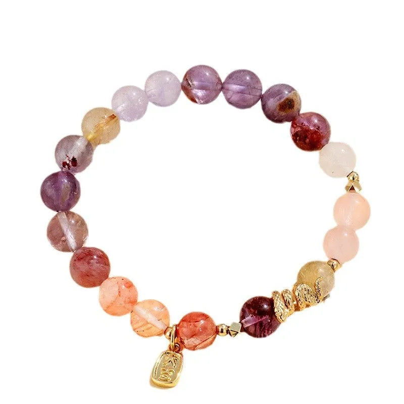 Women's crystal bracelet with lucky snake design and flower beads in amethyst colour