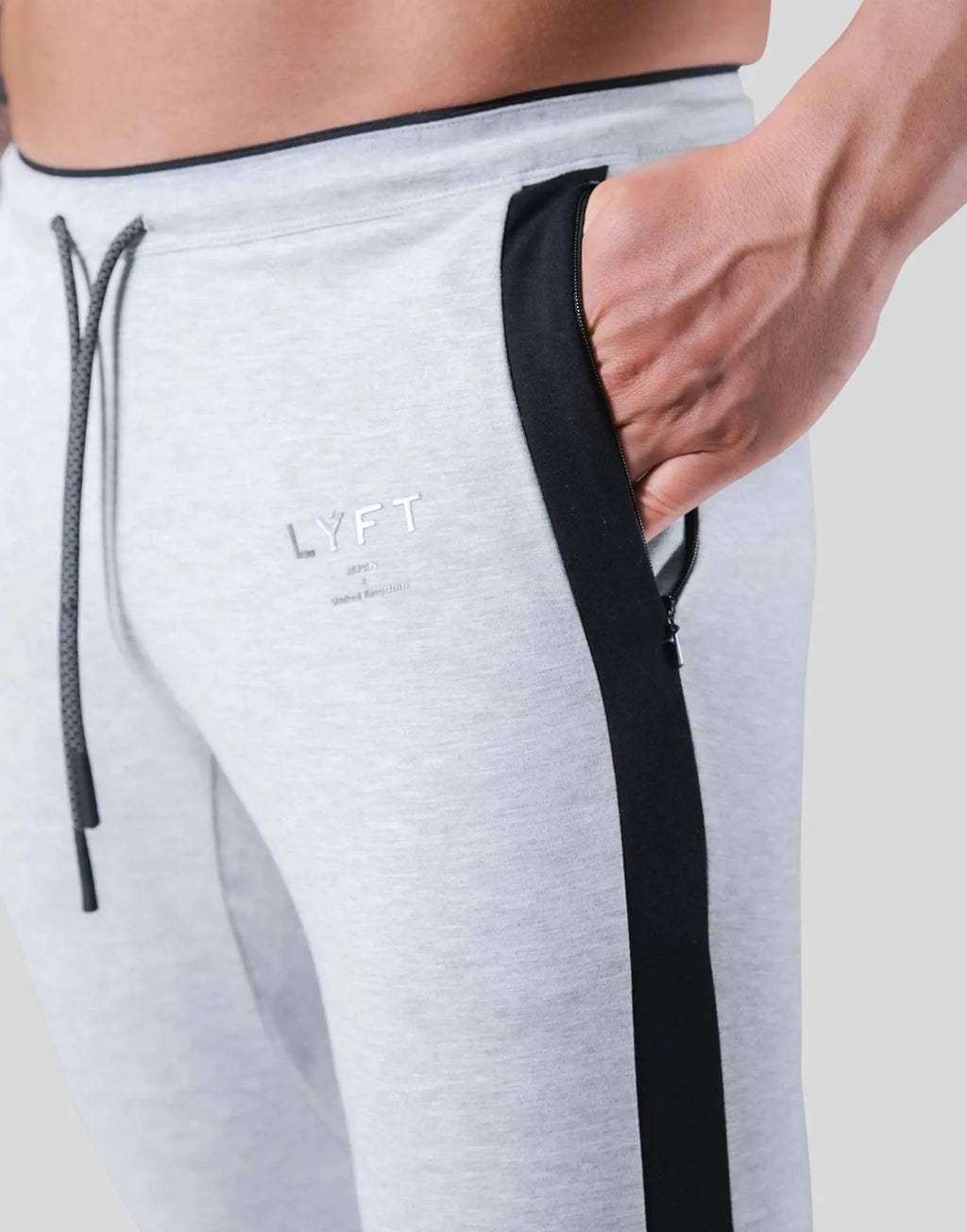 Men's polyester fitness training pants in green, black, navy blue and grey colours for gym workout and bodybuilding