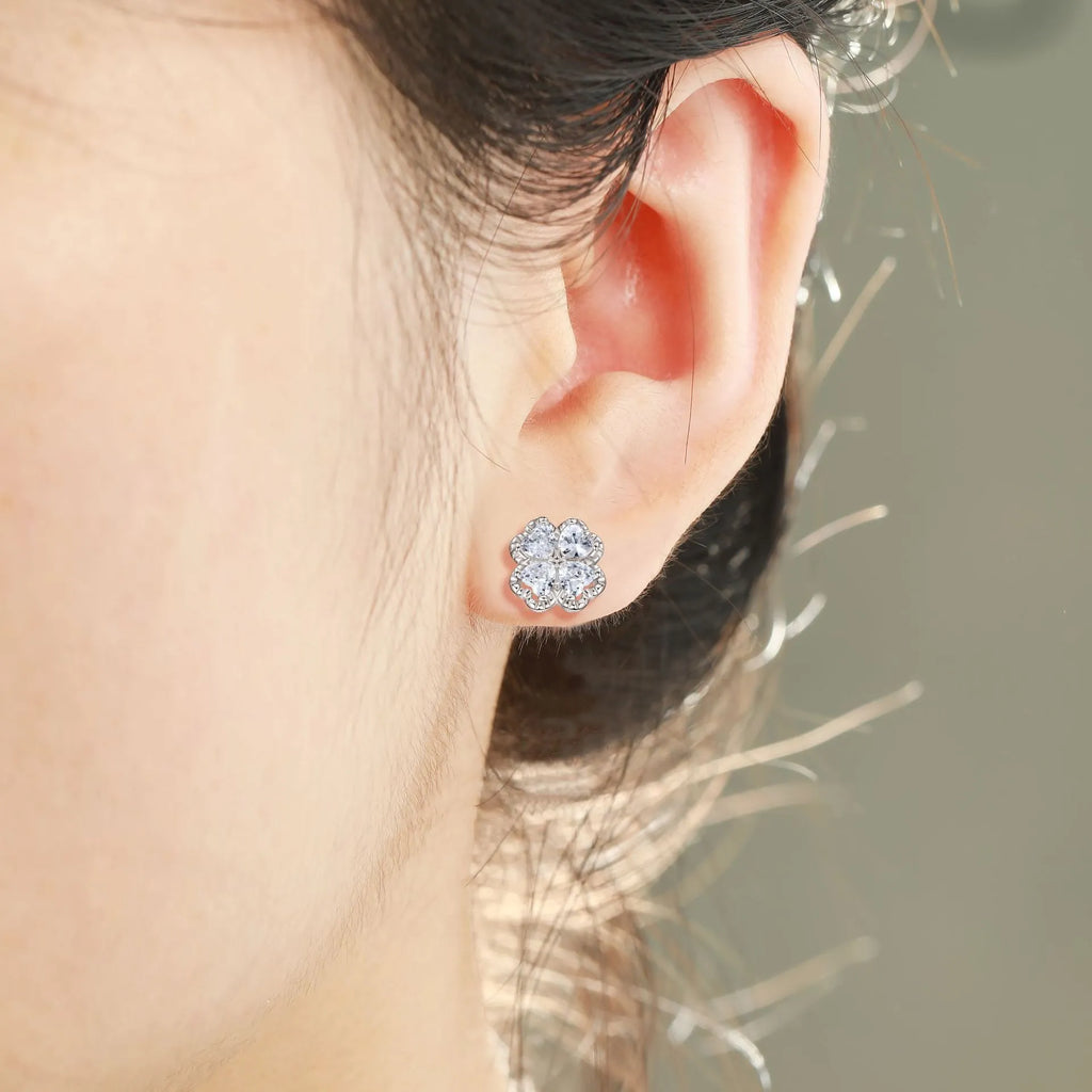 Pair of women's heart-shaped 925 silver earrings with four-leaf clover design and zircon stones.