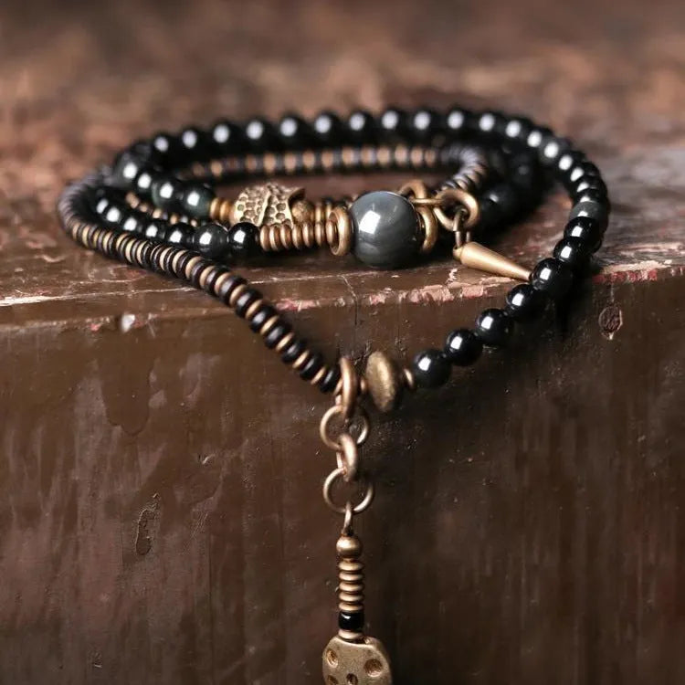 Black geometric beaded bracelet with multi-layered construction