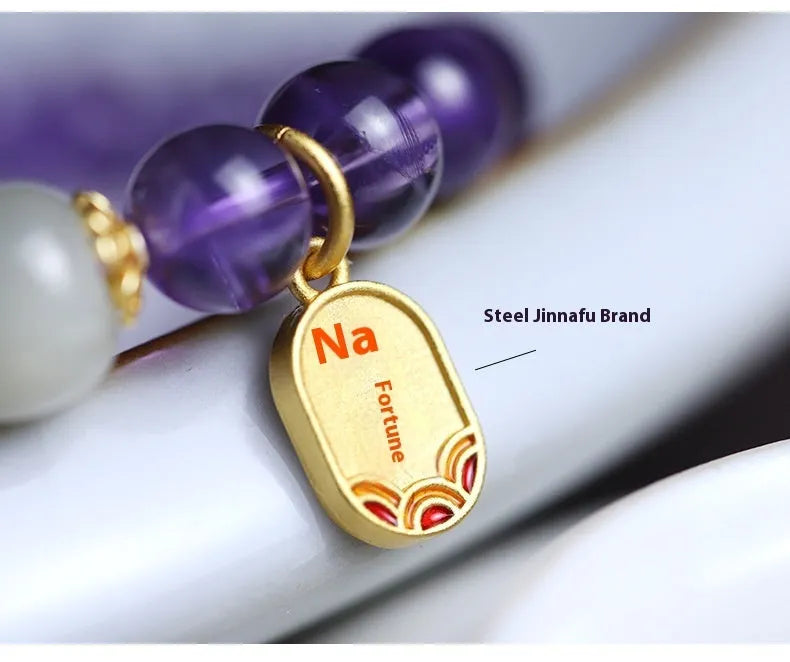 A women's bracelet with purple 8mm amethyst crystal beads arranged in a geometric, national style design.