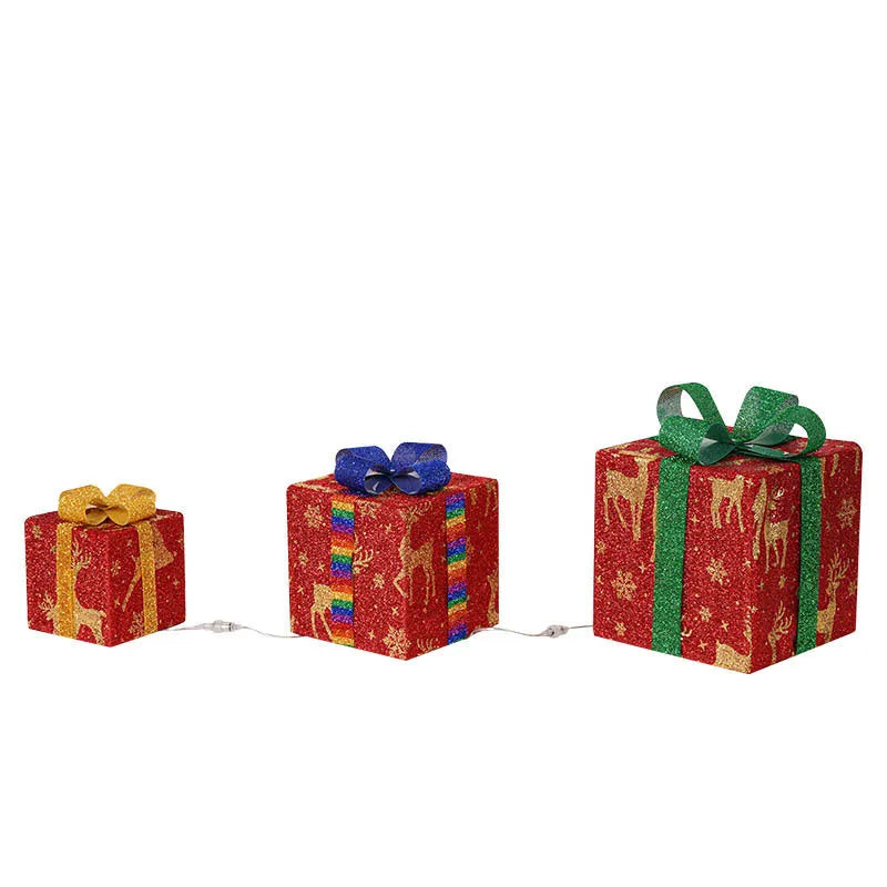 Set of three pre-lit Christmas gift box decorations with bows for outdoor holiday displays