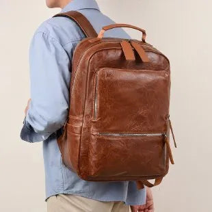 American Vintage large capacity waterproof backpack in solid colour with curved shoulder strap and sewing line detail
