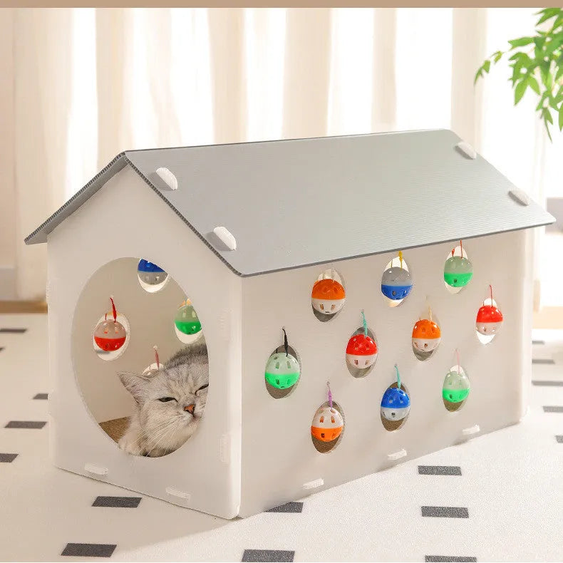 Plastic house-shaped cat scratch board integrated with a cat nest, tunnel, and bell ball toy.