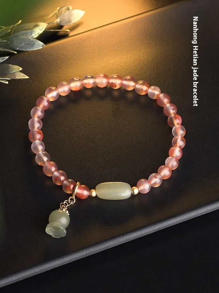 Ice float nanhong agate ethnic bracelet with bamboo joint links and flower decoration in hetian jade colour
