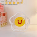 Clear square acrylic storage box with a cute strawberry rabbit character design on a desk.