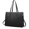 Large black women's business shoulder bag showing computer compartment and three adjustable straps