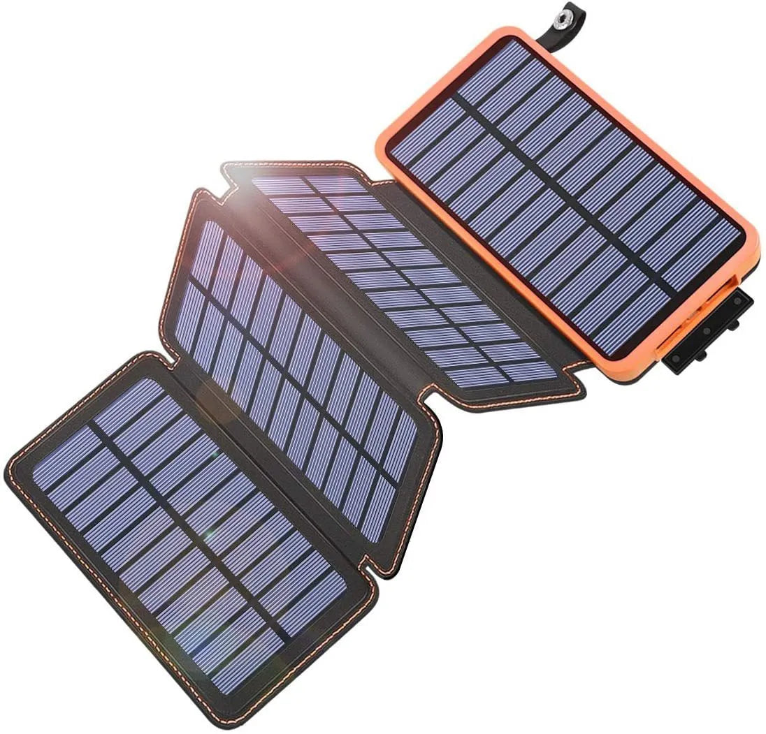 A black outdoor solar power bank with a solar panel, LED light, and soft leather finish, shown with a charging cable.