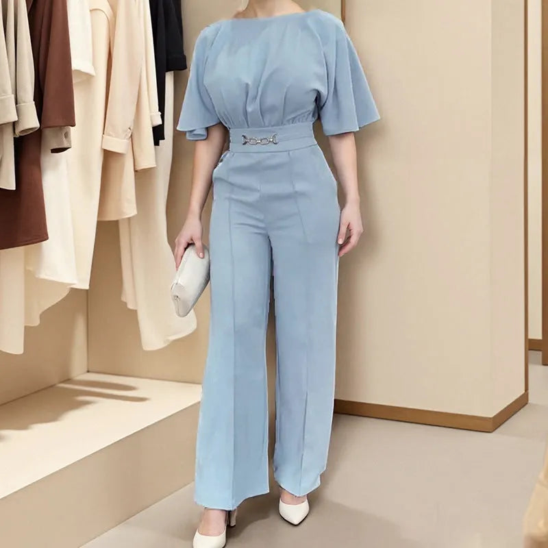 Men's blue two-piece casual suit with long-sleeved jacket and trousers on a hanger.