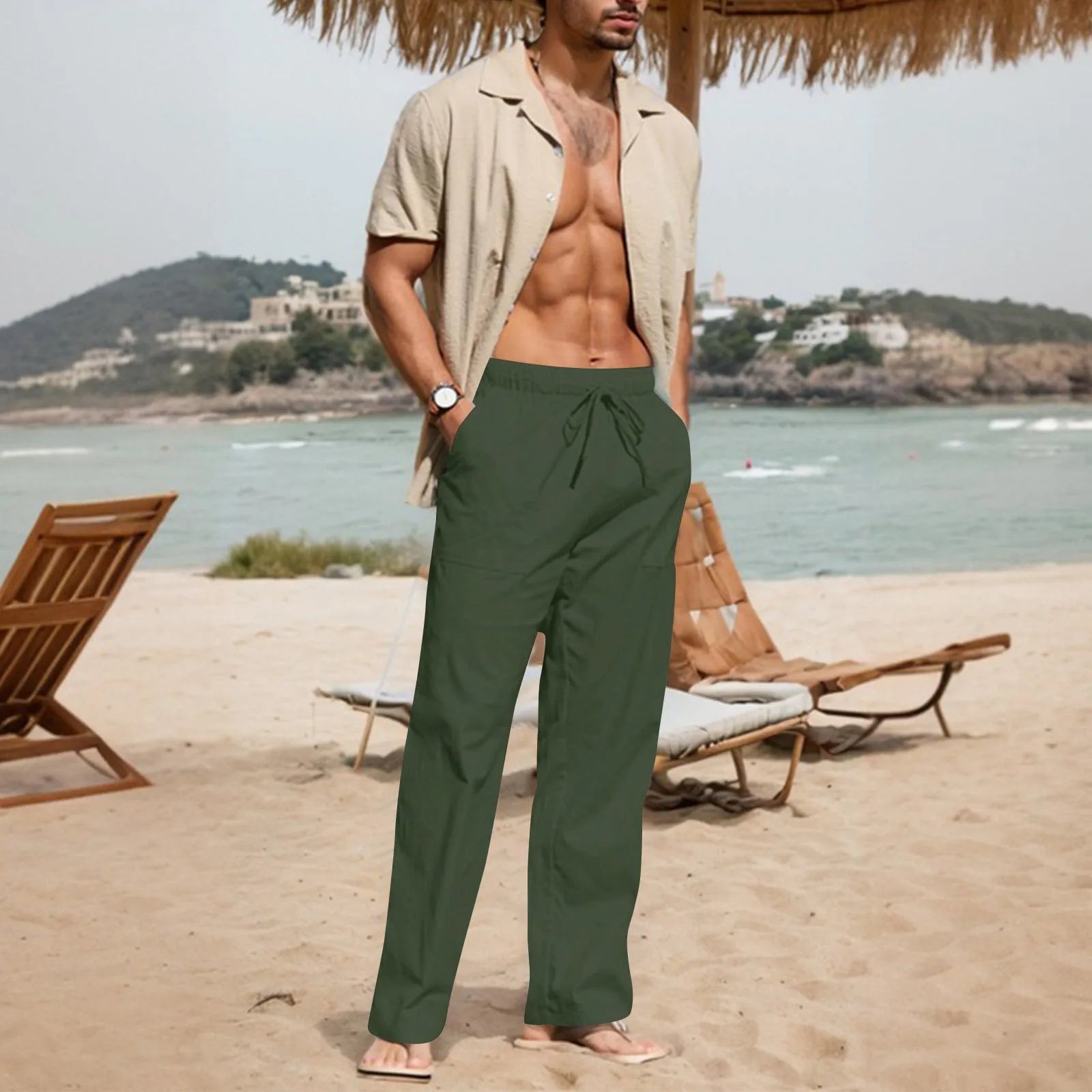 Men's beige cotton linen trousers with drawstring waist and straight legs on a plain background