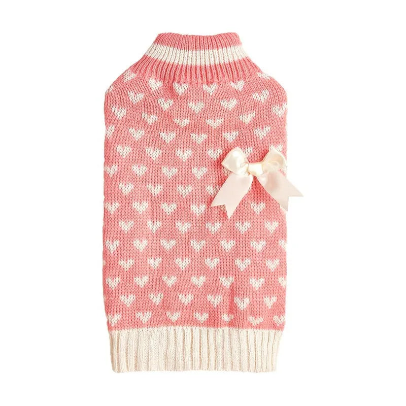 Red love heart design dog sweater on a small dog, showing acrylic knit and appliqué detail.
