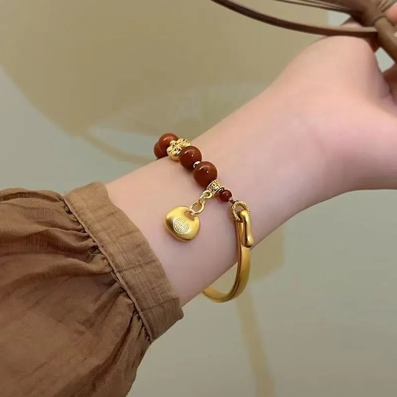 Golden south red agate character ingot women's bracelet with lucky bag design