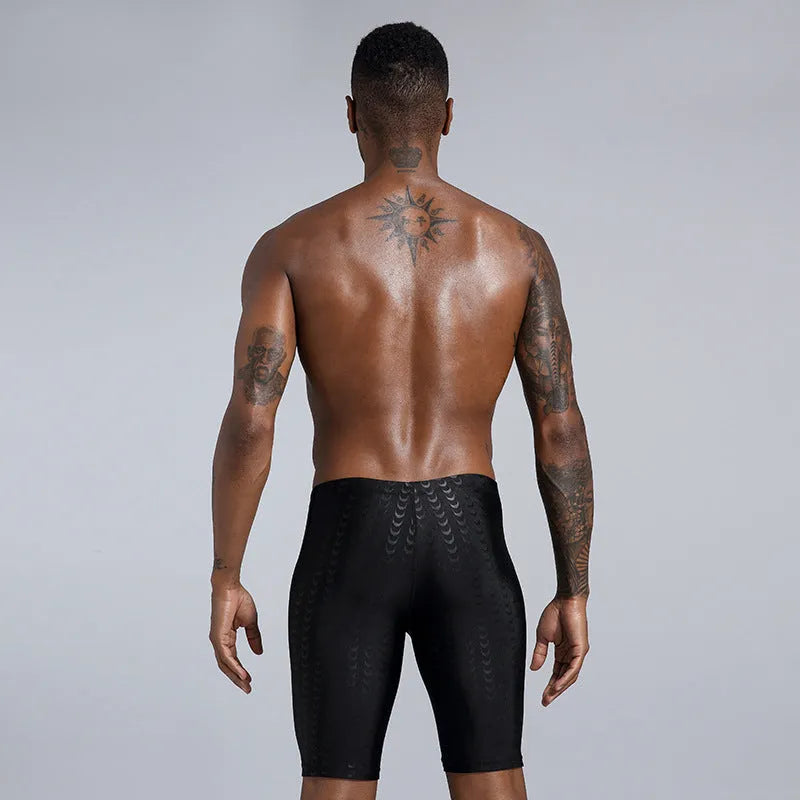Men's solid colour waterproof polyester swimming trunks for beach and surf, shown in larger sizes.