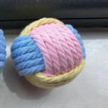 Handmade small blue powder, green blue, and pink green plush cotton ball cat toy for teeth grinding.